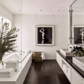 Master bath in black and white with artwork by Victor Skrebneski
