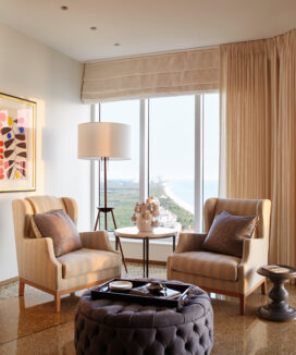 Sitting area with tripod floor lamp by BDDW