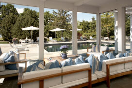 Screened in porch off the kitchen, facing the swimming pool, that can be completely opened up to the outdoors