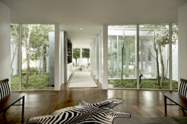 View from front door through hallway atriums to great room