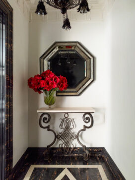 Entry vestibule featuring a console by Gilbert Poillerat