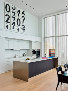 Contemporary kitchen with artwork by Darren Almond and stacked leather trays by Giobagnara Arcobaleno