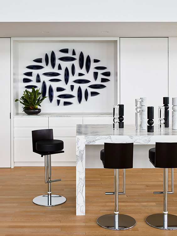 Wet bar featuring porcelain sculpture by Maren Kloppmann