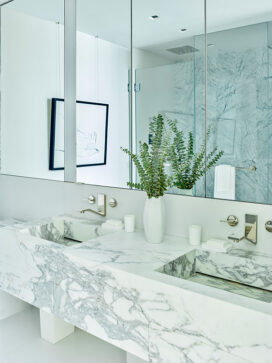 Contemporary master bathroom in white and grey in Miami Beach penthouse designed by Suzanne Lovell Inc.