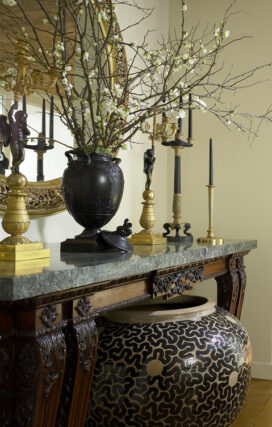 Entry detail featuring a rare Wedgwood vase atop a carved Italian console and ‘A Monumental Vessel’ by Per Weiss