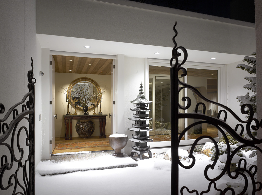 Exterior view of front door, showing French wrought iron entry gates and a Japanese copper pagoda