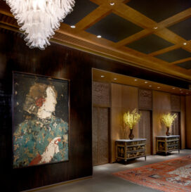 Entry gallery in Chicago skyline penthouse with artwork by Manolo Valdes and Mazzega glass chandelier