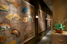 Antique Japanese screens line a hallway in Chicago skyline penthouse