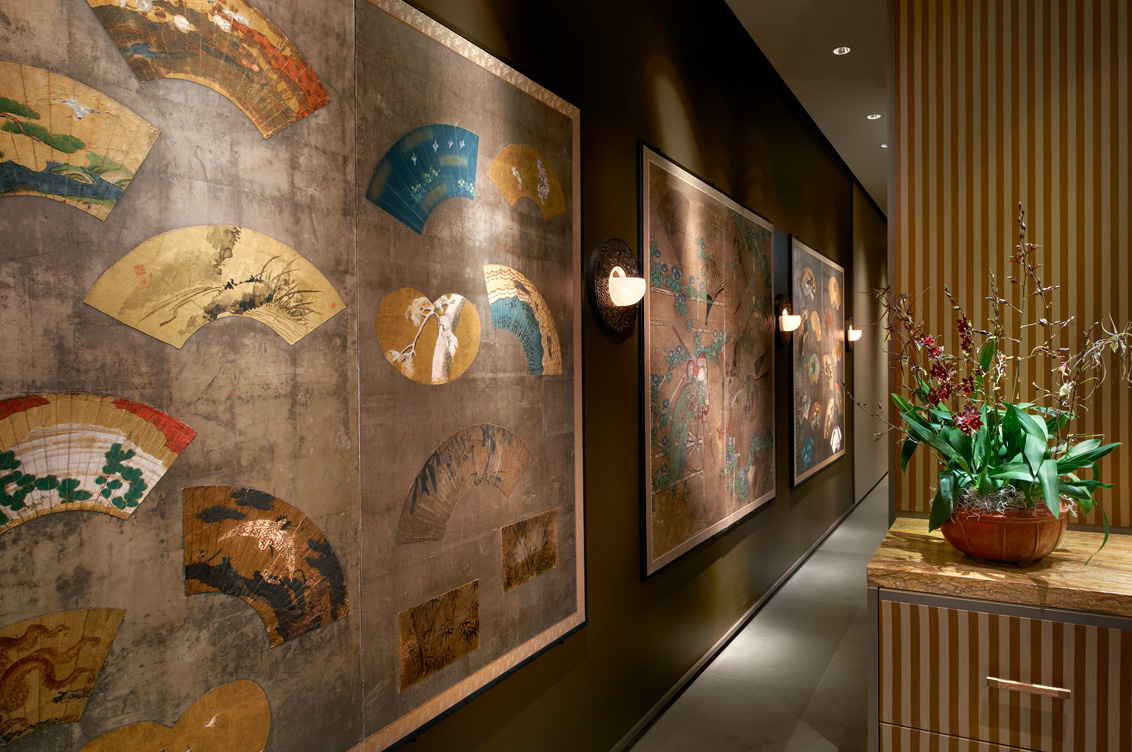 Antique Japanese screens line a hallway in Chicago skyline penthouse