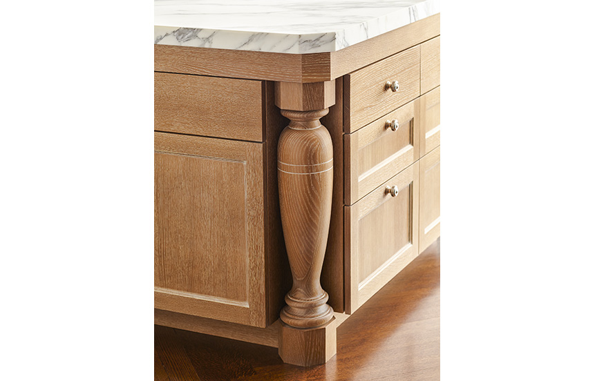 Detail of kitchen island with cerused oak base