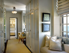 Deco-era duplex apartment dressing closet with window seat and desk off the primary bedroom