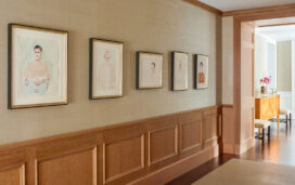 Chicago penthouse hallway with cerused oak paneled millwork and a collection of original artwork by David Hockney