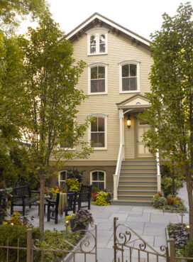 Lincoln Park Chicago landmark residence exterior view of front of house and front patio with seating area