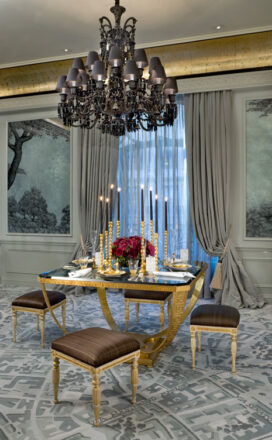 St. Regis NY owner’s suite dining table with black glass top and black Baccarat chandelier