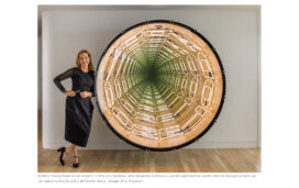 Portrait of Suzanne Lovell in the entry gallery of a penthouse in Miami which includes a large work by Iván Navarro