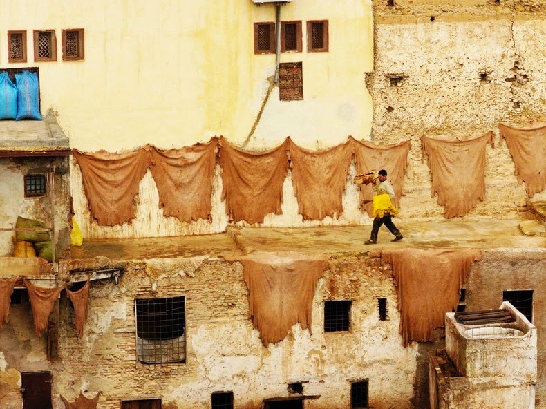 The hides hung outside of buildings drying