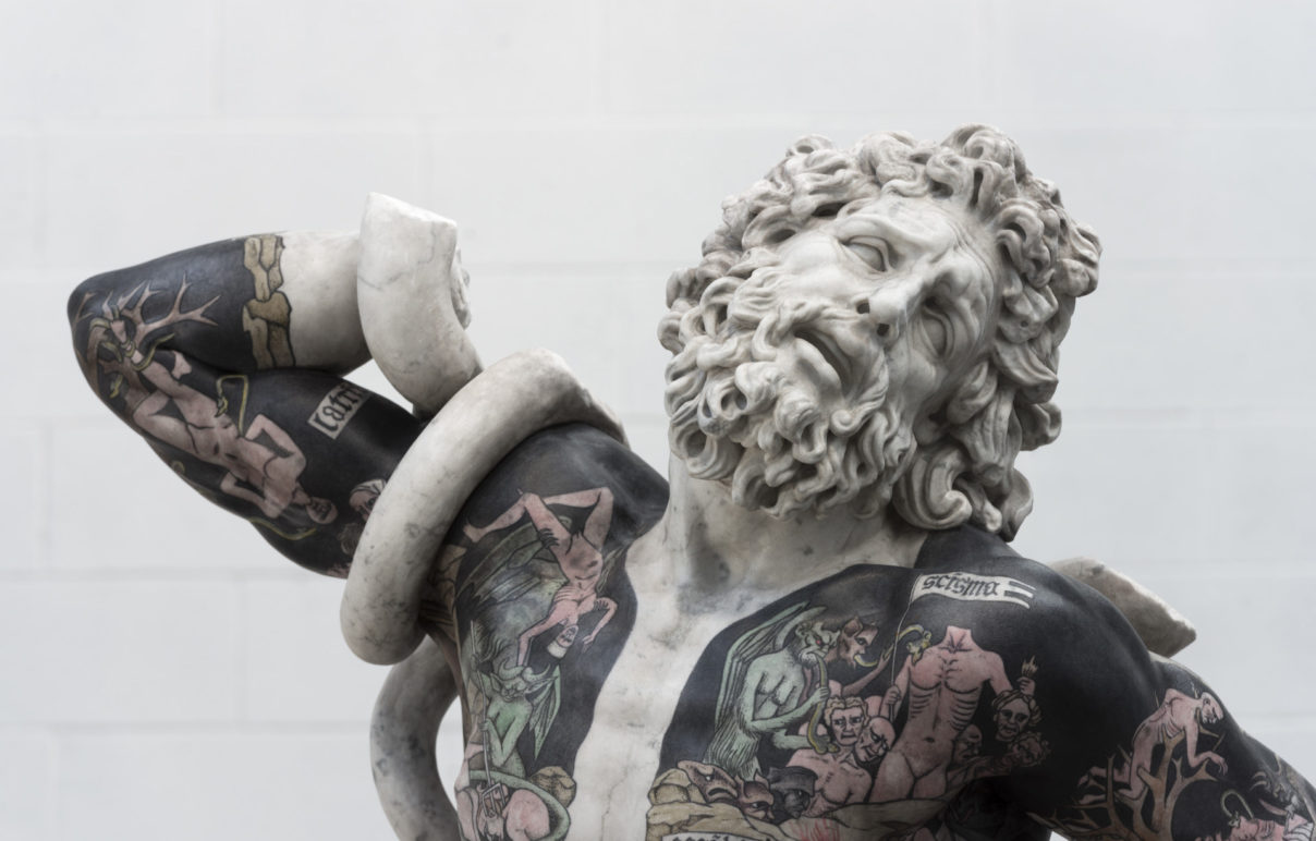 This recreation of Laocoon is tattooed over a black color to make the images more prevalent.