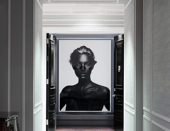 St. Regis, NY owner’s suite entry view from hall with artwork by Nick Knight