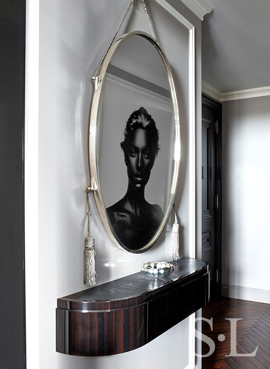 St. Regis, NY owner’s suite entry with artwork by Nick Knight reflected in an original Ruhlmann mirror
