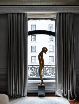 St. Regis, NY owner’s suite primary bedroom detail view with sculpture by Hugo Robus and drapery by Jouffre