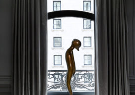 St. Regis, NY owner’s suite primary bedroom detail view with sculpture by Hugo Robus and drapery by Jouffre