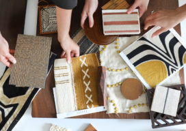 Suzanne Lovell Inc. interior architects and interior designers studying fabrics and architectural materials for a residential project
