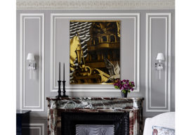 Fireplace detail featuring panel by Dupas and Baccarat sconces
