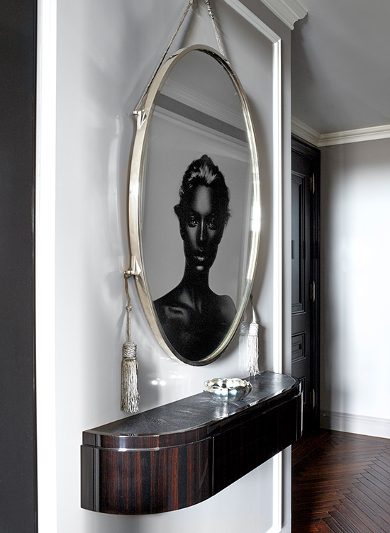 St. Regis, NY owner’s suite entry with artwork by Nick Knight reflected in an original Ruhlmann mirror