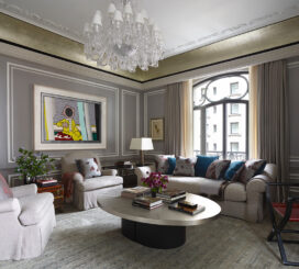 St. Regis, NY owner’s suite living room view featuring Baccarat chandelier and artwork by Roy Lichtenstein