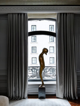 St. Regis, NY owner’s suite primary bedroom detail view with sculpture by Hugo Robus and drapery by Jouffre