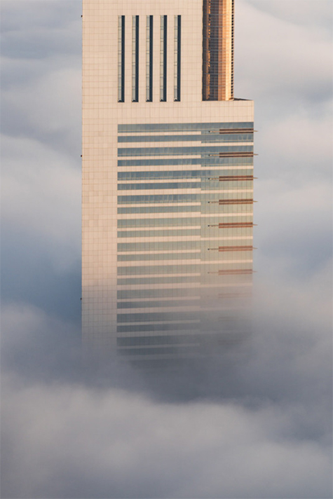 The Dubai skyscraper's top is above the clouds, Albert Dros photography