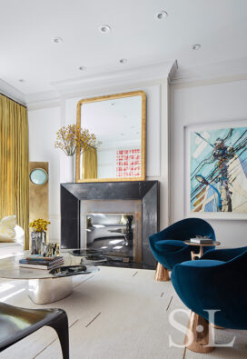 Formal living room in Lincoln Park residence showing fireplace and work by German artist Erik Schmidt