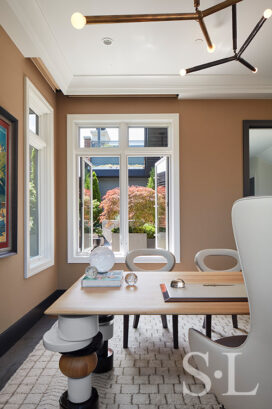 Lincoln Park residence office with desk by India Mahdavi, light fixtures by Apparatus and wing chair by Giorgetti