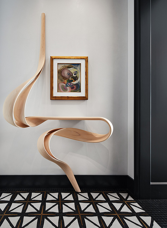 Entryway in Lincoln Park residence with Enignum Shelf by Joseph Walsh and painting by Wolfgang Paalen