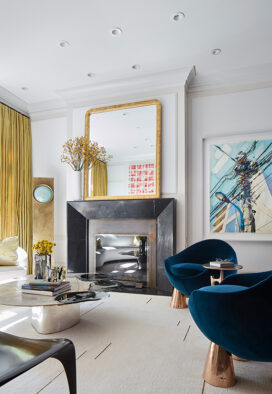 Formal living room in Lincoln Park residence showing fireplace and work by German artist Erik Schmidt