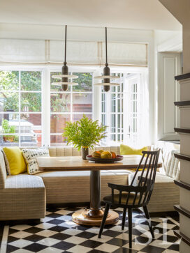 Breakfast room in Oak Park Residence with table by Soane Britain