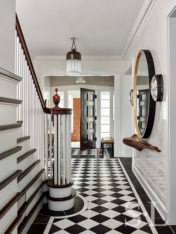 Foyer of Oak Park Landmark Residence with black and white stone floor