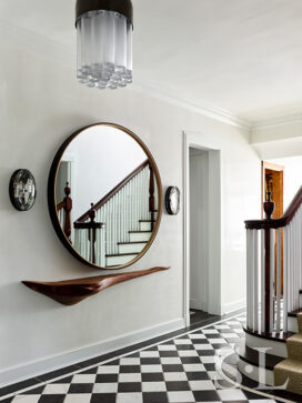 Foyer detail of Oak Park Landmark Residence with large mirror by BDDW