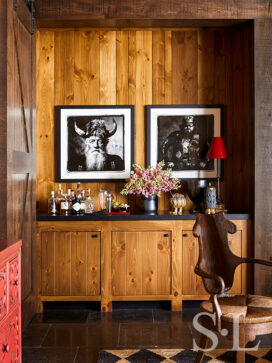 Lakeside residence bar with knotty pine and artwork by Sandro Miller