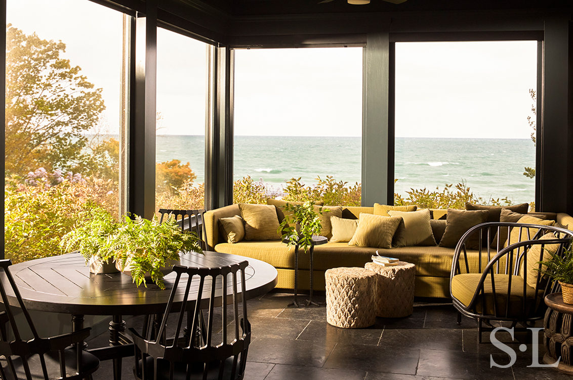 Lakeside residence sun porch with Belgian Bluestone tile flooring and view of Lake Michigan