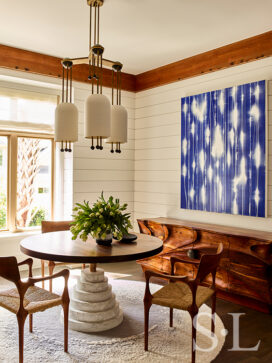 Wine room of luxury vacation residence on Hilton Head Island with artwork by Mark Francis and chandelier by Apparatus