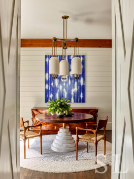 Wine room of luxury vacation residence on Hilton Head Island with artwork by Mark Francis and chandelier by Apparatus