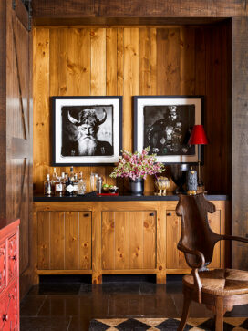Lakeside residence bar with knotty pine and artwork by Sandro Miller