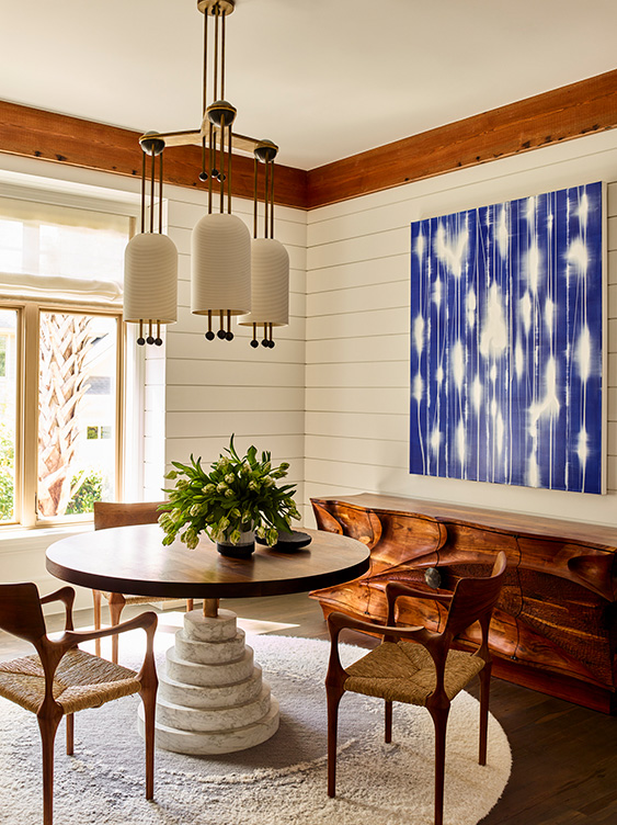 Wine room of luxury vacation residence on Hilton Head Island with artwork by Mark Francis and chandelier by Apparatus