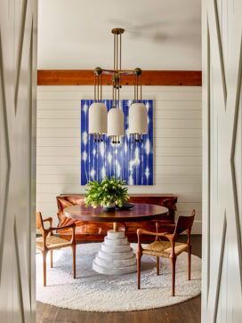 Wine room of luxury vacation residence on Hilton Head Island with artwork by Mark Francis and chandelier by Apparatus