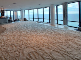 Custom hand-woven rug installation