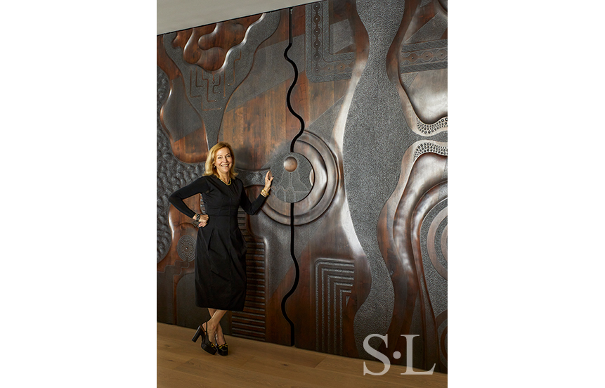 Suzanne Lovell with custom sculpted sliding doors by Caleb Woodard