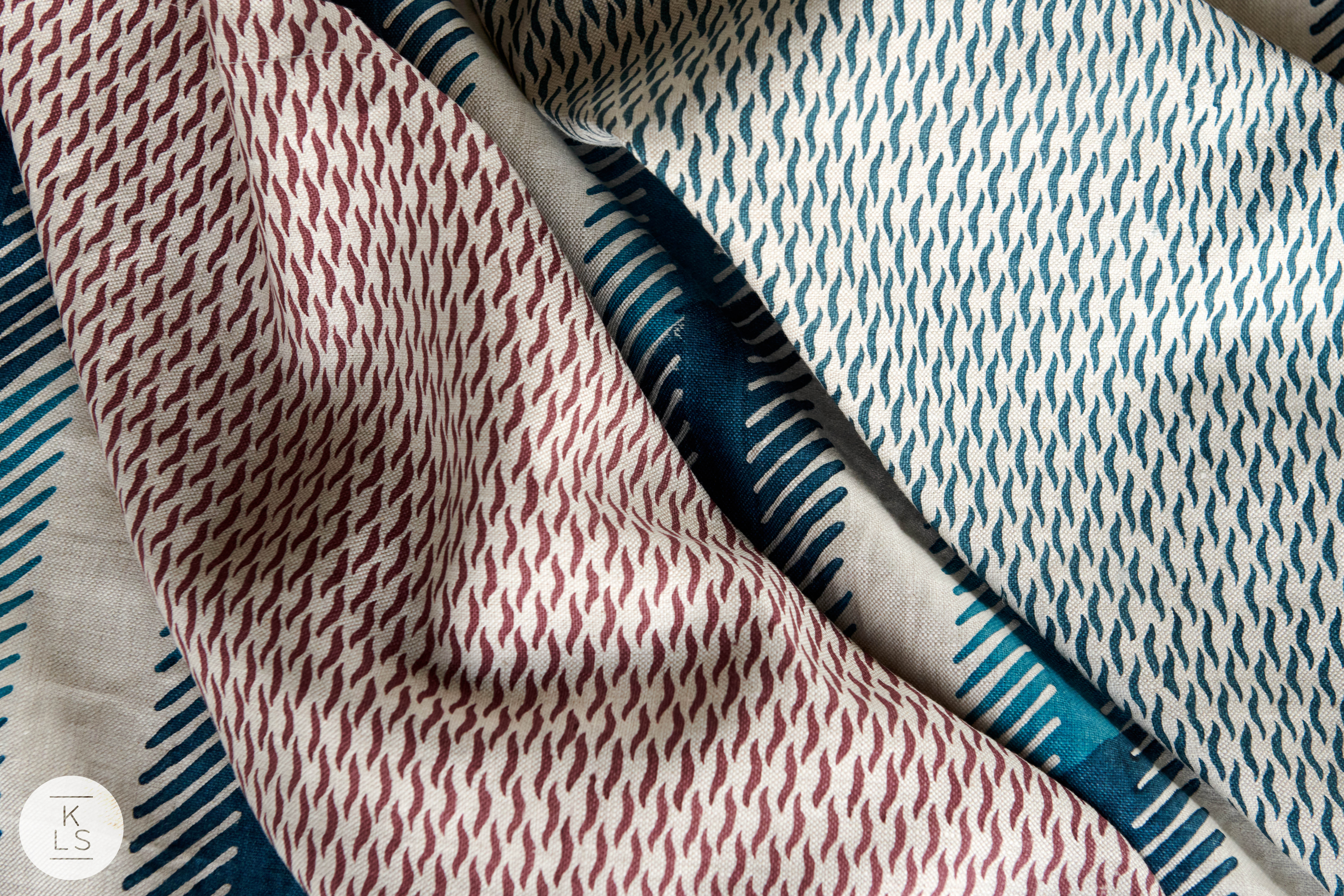 The two outer fabrics are from the Tiger Tiger Collection in Amini Blue and Wineberry; the collection was inspired by a tiger's coat.The center fabric is the Dekka Strip in Nila Blue.
