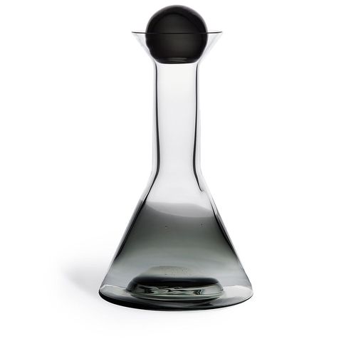 Black glass Tank decanter from Tom Dixon featuring a transparent design, a Mouth blown design and a hand-painted copper detailing. This item comes with a gift box.
