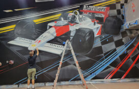 Formula 1 mural being painted in car condo designed by Suzanne Lovell